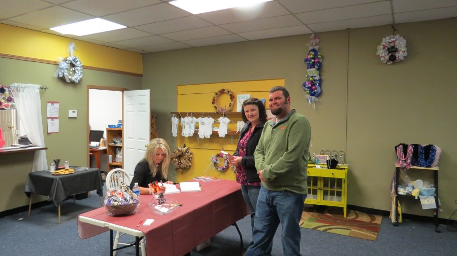 Author Renee Johnson signing copies of her novel Acquisition