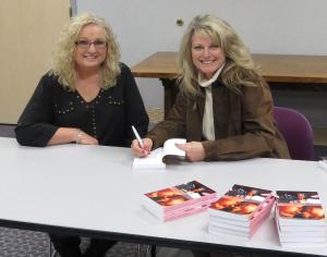 Signing a copy for Jayne Bauguess